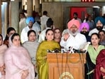 Punjab finance minister Harpal Cheema, flanked by AAP women MLAs, interacting with the media regarding Congress MLA Sukhpal Singh Khaira’s comments on Wednesday. (Ravi Kumar/HT)