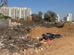 Residents said illegal garbage dumping near Vipul Lavanya Society has grown over a year, with frequent waste burning posing health risks. (Parveen Kumar/HT)