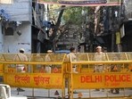 Security personnel deployed at the demolition site in Uttam Nagar after a massive uproar over the killing of a 26-year-old man during Holi celebrations on March 8. (Hindustan Times)