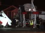 Kankakee Illinois tornado: Debris covers vehicles and damged a structure after a severe storm passed the area in Kankakee County, Ill., late Tuesday, March 10, 2026.  (WLS-TV via AP)