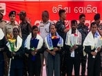 Ten Maoist cadres, including a state committee member, lay down arms before Odisha Police in Kandhamal. Ten Maoist cadres, including a state committee member, lay down arms before Odisha Police in Kandhamal.