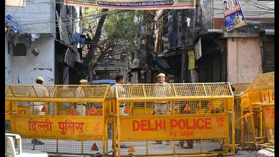 Security personnel deployed at the demolition site in Uttam Nagar after a massive uproar over the killing of a 26-year-old man during Holi celebrations on March 8. (Hindustan Times)