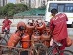 Workers load LPG cylinders in a cart in Mumbai on Wednesday, 11 March 2026. The government has raised LPG cylinder prices for the first time in nearly a year to <span class='webrupee'>₹</span>913.