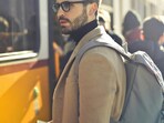 A sleek transit backpack packed with clothes and a laptop, ready for a quick weekend escape without bulky suitcases.