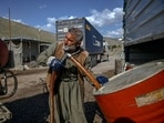 A petrol vendor pumps petrol from Iranian fuel oil tankers for resale near the Bashmagh border crossing.