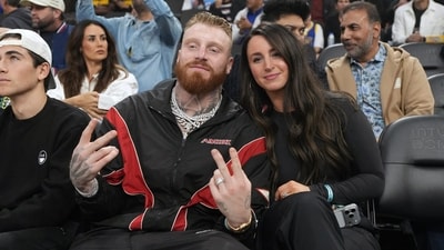 Las Vegas Raiders defensive end Maxx Crosby (left) and wife Rachel Washburn attend the game between the Golden State Warriors and the LA Clippers (IMAGN IMAGES via Reuters Connect)