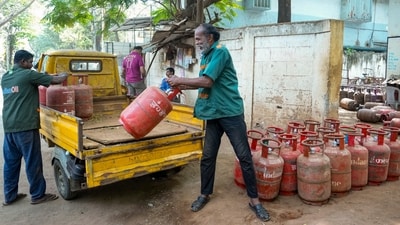 Delivery personnel transfer LPG cylinders amid a panic among people related to LPG supply shortage (PTI) Delivery personnel transfer LPG cylinders amid a panic among people related to LPG supply shortage (PTI)