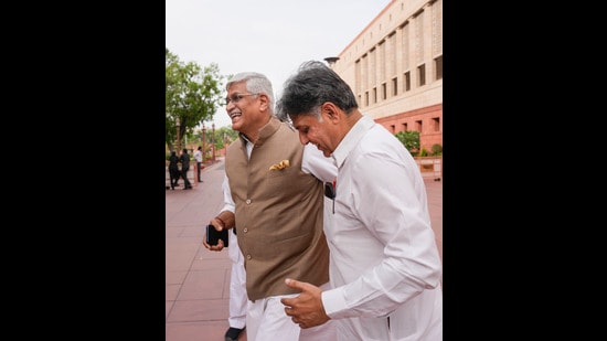 Congress MP Manish Tewari, along with Union minister Gajendra Singh Shekhawat, outside Lok Sabha on Thursday. (PTI)