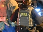 The FBI said 11 Indians have been charged in connection with staged armed robberies. The FBI said 11 Indians have been charged in connection with staged armed robberies.
