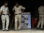 Police stand guard outside a cinema hall which is screening newly released bollywood film Aarakshan, in Mumbai.