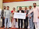 The chairman also handed over sanction letters/cheques to members of joint liability groups . (HT Photo)