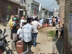 The serpentine queue for a domestic gas cylinder at Sehna village in Barnala district on Friday morning. (HT Photo)
