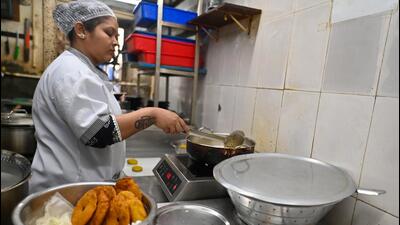 Ashwini Kadam, 31, who prepares snacks at the restaurant, said cooking on induction stoves requires thrice the time compared to LPG stoves (Raju Shinde/ HT Photo)