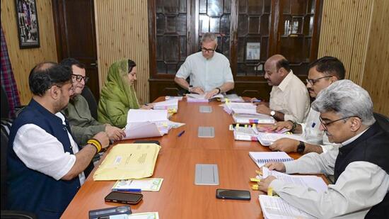 Chief minister Omar Abdullah (centre) with deputy CM Surinder Kumar Choudhary and other cabinet colleagues during a meeting in Jammu on Friday. (PTI Photo)