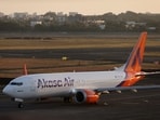 An Akasa Air passenger aircraft taxis on the tarmac at Chhatrapati Shivaji International Airport in Mumbai.