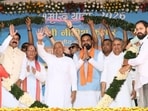 Bihar CM Nitish Kumar with Deputy CM Samrat Choudhary being garlanded during his Samriddhi Yatra at Sheikhpura, Bihar, on Saturday. (HT Photo)