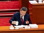 China's President Xi Jinping pours tea at the National People's Congress in Beijing.