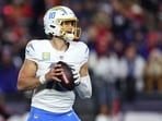 Justin Herbert #10 of the Los Angeles Chargers looks to pass the ball against the New England Patriots