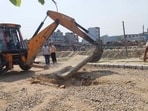 MC demolishes under construction illegal colony in Durga colony in Ludhiana on Friday. (HT Photo)