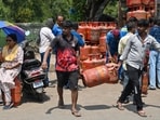 Mumbai, India. Mar 14, 2026 - People carry a household LPG cylinder they received after waiting in a long queue. People queued up to collect their household LPG cylinders amid an ongoing LPG shortage in Mumbai, India. Mar 14, 2026. (Photo by Raju Shinde/HT Photo) (Raju Shinde) Mumbai, India. Mar 14, 2026 - People carry a household LPG cylinder they received after waiting in a long queue. People queued up to collect their household LPG cylinders amid an ongoing LPG shortage in Mumbai, India. Mar 14, 2026. (Photo by Raju Shinde/HT Photo) (Raju Shinde)
