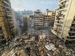 A photograph shows the site of an overnight Israeli airstrike that targeted the Haret Hreik neighbourhood of Beirut's southern suburbs, on March 14, 2026.