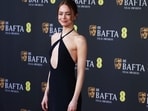 Emma Stone poses on the red carpet during the 2026 BAFTAs.