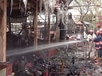 Firefighters trying to douse the fire that broke out at a nature bazaar of Andheria Mod, in New Delhi on Sunday. (ANI Video Grab)