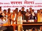 Deputy CM Keshav Prasad Maurya, BJP MP Ravi Kishen and others at the mela in Prayagraj on Saturday. (Anil Kumar Maurya/HT photo)