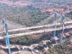 Engineers build segments of the bridge outward from each side while suspending them using steel cables anchored to towering pylons. (HT)
