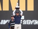 First place individual champion, Captain Bryson DeChambeau of Crushers GC, holds the trophy during the trophy ceremony after the final round of Aramco LIV Golf Singapore on Sunday, March 15, 2026 in Sentosa, Singapore. (Mateo Villalba/LIV Golf via AP)