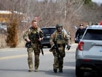 FBI members work on the site after the Michigan State Police reported an active shooting incident at the Temple Israel Synagogue in West Bloomfield, Michigan, U.S., March 12, 2026. 