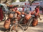 New Delhi: LPG cylinder delivery personnel prepare for distribution outside a gas agency in New Delhi, Wednesday, March 11, 2026.