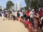People wait in a queue to collect LPG cylinders at the Vikas Nagar Mini-Stadium ground in Lucknow on Saturday. (Deepak Gupta/HT) People wait in a queue to collect LPG cylinders at the Vikas Nagar Mini-Stadium ground in Lucknow on Saturday. (Deepak Gupta/HT)