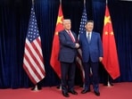 President Donald Trump, left, and Chinese President Xi Jinping, right, shake hands before their meeting before their meeting at Gimhae International Airport in Busan, South Korea, Thursday, Oct. 30, 2025.