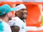Former Miami Dolphins quarterback Tua Tagovailoa smiles on the bench during an NFL football game against the New Orleans Saints Former Miami Dolphins quarterback Tua Tagovailoa smiles on the bench during an NFL football game against the New Orleans Saints