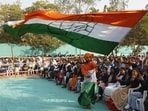 A man waves a Congress flag at a rally in Gujarat.
