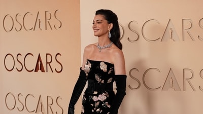 Anne Hathaway arrives at the Oscars on Sunday. (Gregory Bull/Invision/AP) Anne Hathaway arrives at the Oscars on Sunday. (Gregory Bull/Invision/AP)