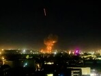 This photograph shows smoke and flames rising from an area hit by airstrikes, in Kabul on March 16, 2026. 