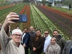 Jammu and Kashmir chief minister Omar Abdullah taking a selfie along with his cabinet colleagues after throwing open the Tulip Garden in Srinagar on Monday. (Waseem Andrabi/HT)