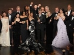 Jose Antonio Garcia, from left, Florencia Martin, Leonardo DiCaprio, Cassandra Kulukundis, Regina Hall, Shayna McHale, Teyana Taylor, Michael Bauman, Paul Thomas Anderson, Anthony Carlino, Will Weike, Sara Murphy, Chase Infiniti, Christopher Scarabosio, and Andy Jurgensen accept the award for best picture award for 