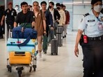Thai crew members of the bulk carrier Mayuree Naree arrive at Suvarnabhumi International Airport after a flight from Oman, in Bangkok on March 16, 2026. Iran's Revolutionary Guards said on March 11 they had struck the Thai-registered Mayuree Naree, as well as a Liberia-flagged vessel, in the Strait of Hormuz because the ships had ignored "warnings".