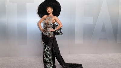 Rita Ora brought her A-game in a Tamara Ralph gown, featuring a sheer black corseted bodice with soft floral embroidery and a black train that was tied together in a huge bow in the back. The look was paired with a massive feathered hat that made quite the statement! (REUTERS)