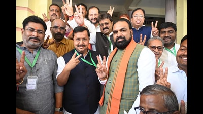 Bihar Deputy CM Samrat Choudhary, BJP Rajya Sabha candidates Nitin Nabin and Shivesh Ram and party MLAs flash victory sign after casting votes during the Rajya Sabha election at the Bihar Assembly in Patna on Monday. (Santosh Kumar/ht)