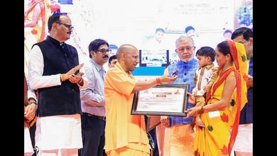 Chief minister Yogi Adityanath during the transfer of the first instalment of grants to the bank accounts of 90,000 beneficiaries under the Pradhan Mantri Awas Yojana, in Lucknow on Monday. (@myogiadityanath) Chief minister Yogi Adityanath during the transfer of the first instalment of grants to the bank accounts of 90,000 beneficiaries under the Pradhan Mantri Awas Yojana, in Lucknow on Monday. (@myogiadityanath)