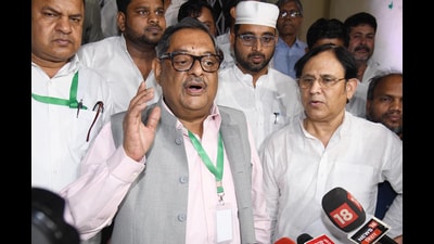RJD Rajya Sabha candidate Amrendra Dhari Singh speaks to the media after party his loss in the Rajya Sabha elections on Monday. (Santosh Kumar/HT)