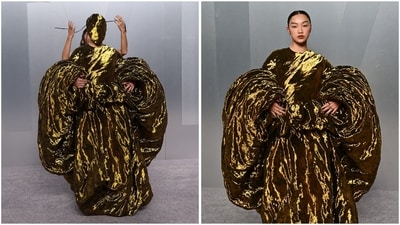 K-pop Demon Hunters star Audrey Nuna looked drenched in liquid gold in a masked Maison Margiela ensemble. The bold sculptural gown featured exaggerated voluminous sleeves and a molten metallic texture, creating an avant-garde silhouette. (REUTERS) K-pop Demon Hunters star Audrey Nuna looked drenched in liquid gold in a masked Maison Margiela ensemble. The bold sculptural gown featured exaggerated voluminous sleeves and a molten metallic texture, creating an avant-garde silhouette. (REUTERS)