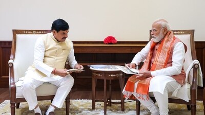 Mohan Yadav meets Narendra Modi at Parliament House in New Delhi on Sunday.