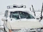 A view of a car covered in snow as temperatures plummet across the region, in Sonamarg on Monday. (ANI video Grab) A view of a car covered in snow as temperatures plummet across the region, in Sonamarg on Monday. (ANI video Grab)