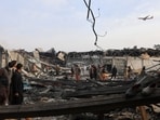 Residents and volunteers inspect the site of a late-Monday airstrike at a drug rehabilitation hospital in Kabul, Afghanistan.