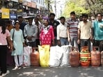 Consumers block the road outside a gas agency in Viram Khand, Gomti Nagar, in Lucknow, on Monday, protesting after failing to receive LPG cylinder. (Deepak Gupta/HT Photo)